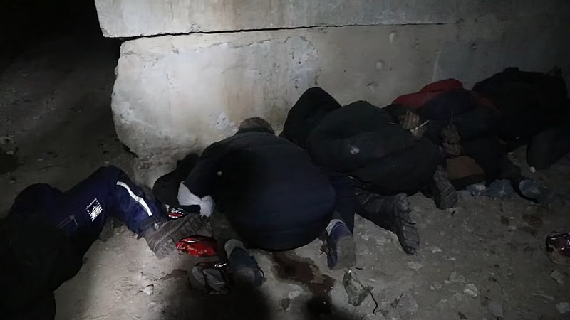 The bodies of people in the basement of one of Bucha's houses. On the arm of one of the dead, a white bandage is visible - a Russian identification mark